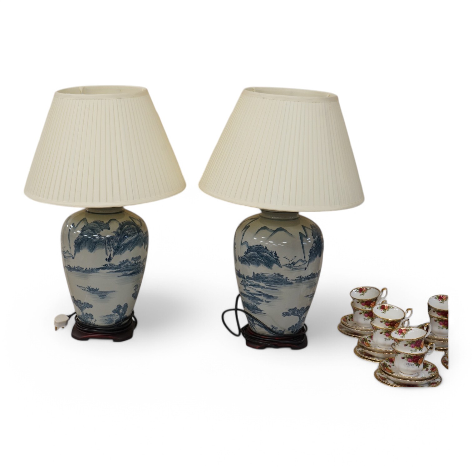 A pair of Japanese blue and white ceramic table lamps and shades, 71cm high overall. Condition - good, untested